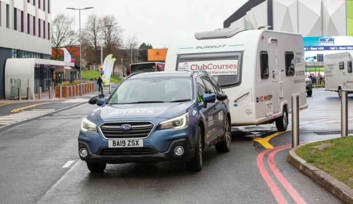 A car towing a caravan