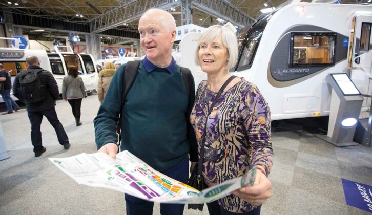 A couple holding a map at the NEC Show