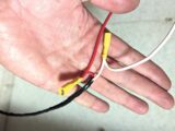 A hand holding connectors