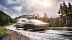 Blurred image of a car towing a caravan