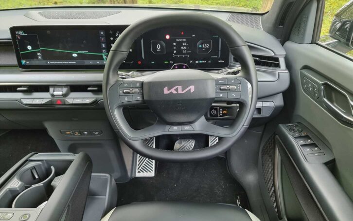 The steering wheel and infotainment screen in the cabin