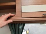 Checking the furniture edging of a cabinet