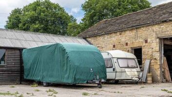 A covered caravan and a tourer without a cover