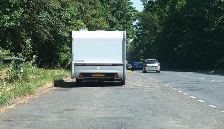 Following the van as it's towed away