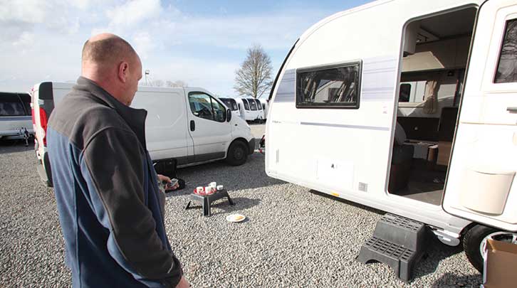 Andy standing outside the tourer testing the alarm