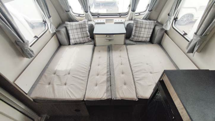 Swift caravan's couches unfolded into double bed.