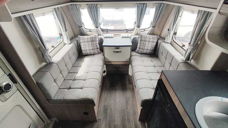 Two couches surrounded by windows in the Swift living area. 