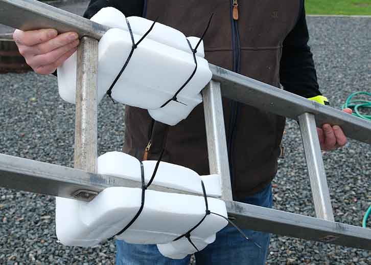 A ladder with foam packaging so it will not damage the caravan's roof