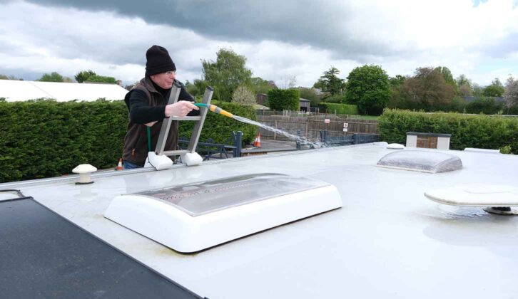 Hosing the roof to soften the dirt