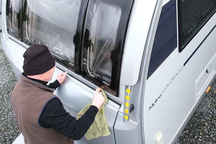 Wiping off dirt at the front of the tourer