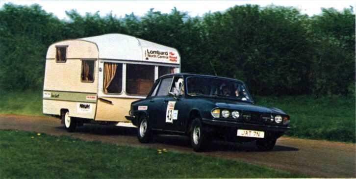 A caravan towing a car