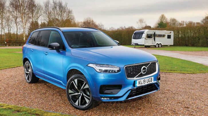 The Volvo XC90 with a caravan in the background