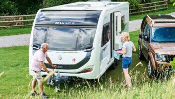 A couple pitched up with their car and caravan